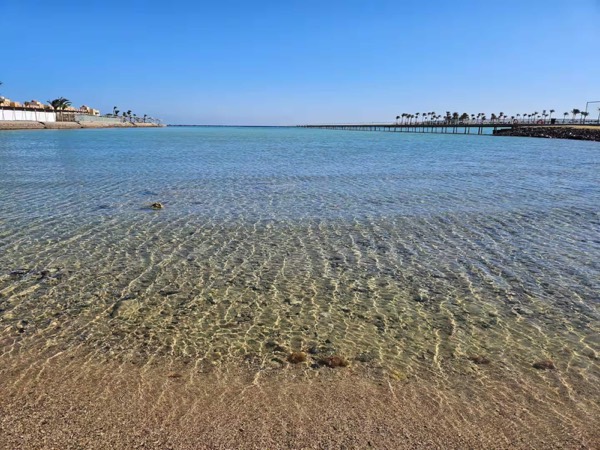 Clear, calm water at the beach across the road